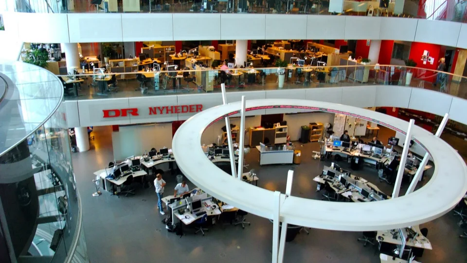 Open-plan newsroom at Danish broadcaster DR with journalists at desks