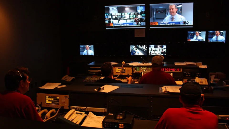 Producers operating a live television broadcast in a studio control room