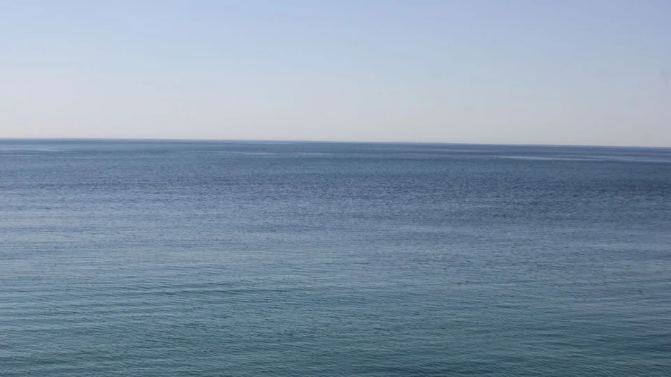 Tranquil view of Lake Ontario's serene blue waters and horizon, capturing peace and calm.