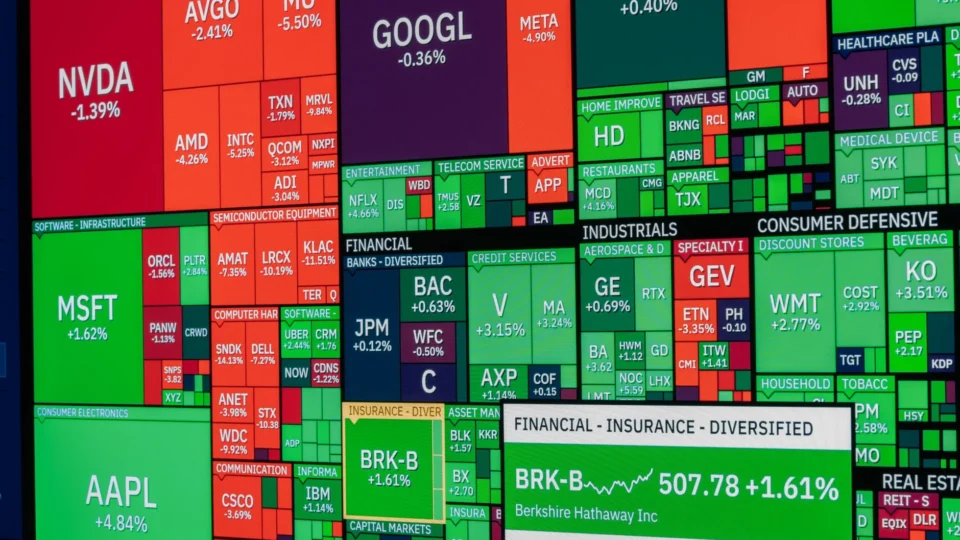 Vibrant stock market heat map displaying various company performances on a monitor.