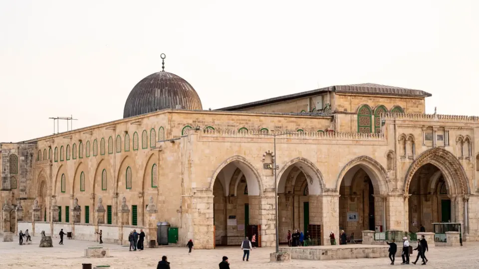 View of Al-Aqsa Mosque with visitors, capturing the architectural beauty in Jerusalem.