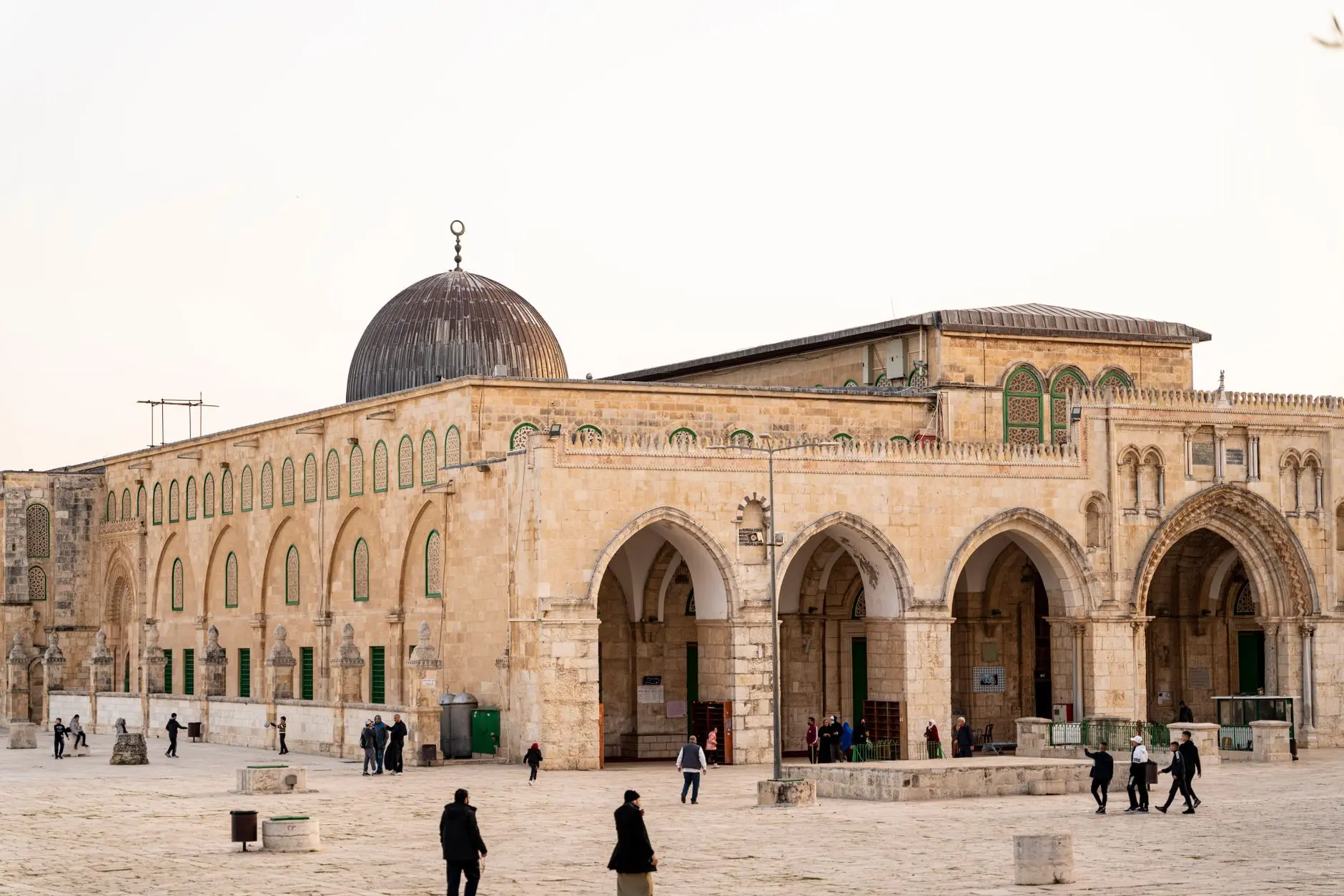 View of Al-Aqsa Mosque with visitors, capturing the architectural beauty in Jerusalem.