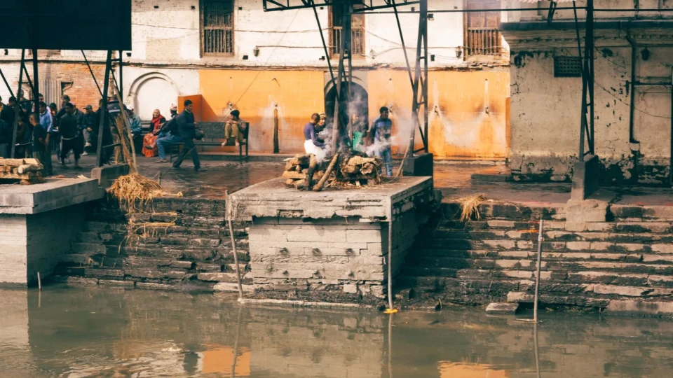 Cremation rituals along the Bagmati River at Pashupatinath Temple, a UNESCO World Heritage Site in Kathmandu, Nepal.