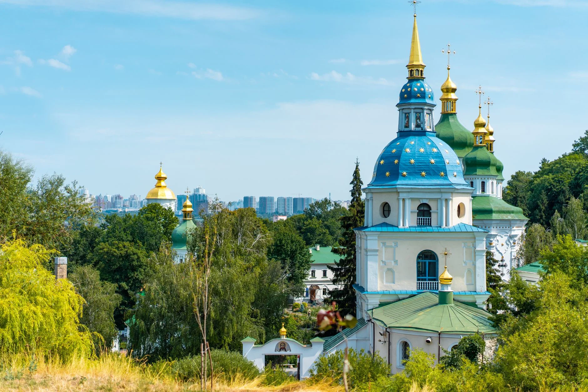 Scenic view of St. Michael's Golden-Domed Monastery in Kyiv, Ukraine with clear blue sky.