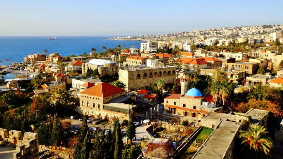 Aerial view of Byblos, Lebanon showcasing historic architecture, coastline, and vibrant city life.