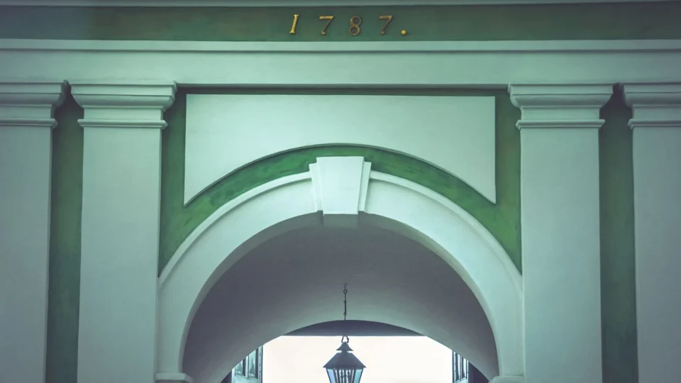 A beautiful archway with classic columns in St. Petersburg, showcasing historical architecture from 1787.