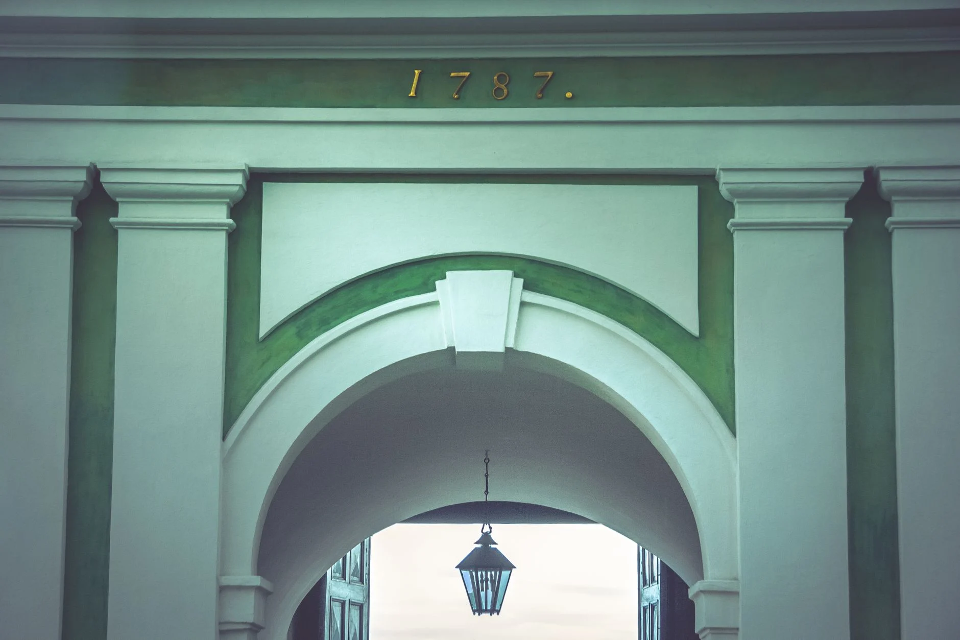 A beautiful archway with classic columns in St. Petersburg, showcasing historical architecture from 1787.