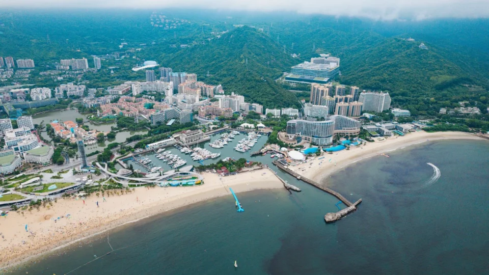 Aerial view of a vibrant beachfront cityscape along Shenzhen Bay in China. Perfect for travel and architecture themes.
