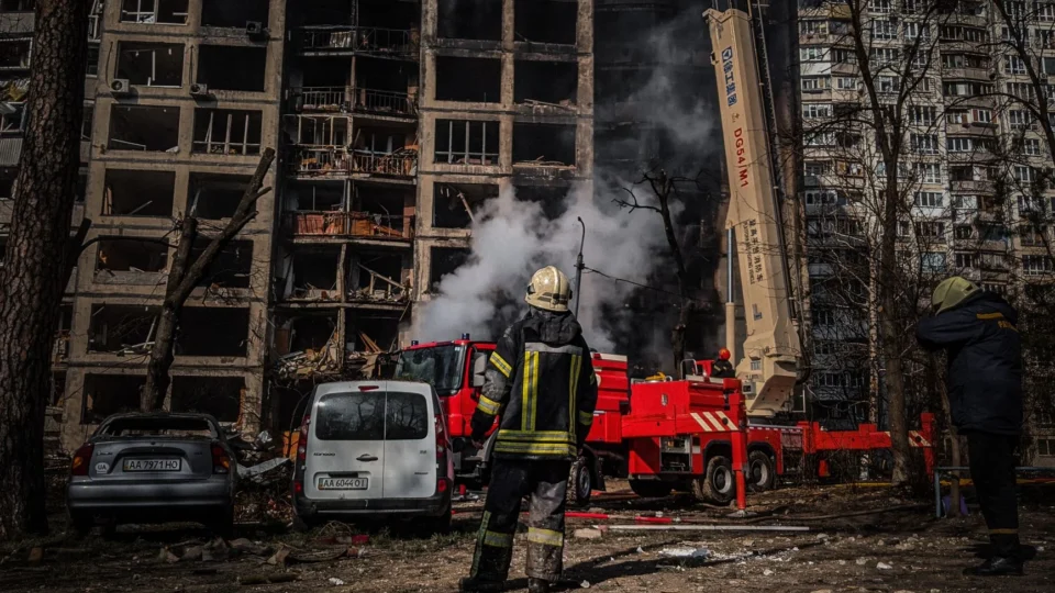 Firefighters tackle a blaze in a damaged building in Kyiv, Ukraine.
