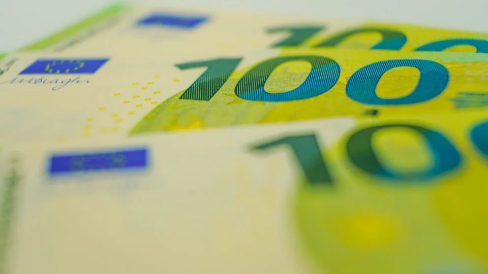 Euro banknotes in close-up with focus on 100 denomination. Perfect for financial themes.