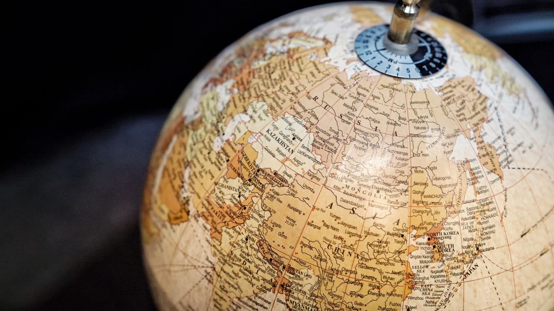 Close-up of a vintage style globe with a focus on Asia and surrounding regions.
