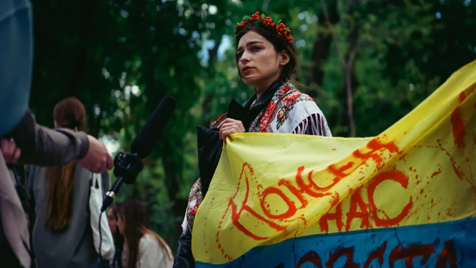 A determined woman holds a peace banner during a demonstration in Kyiv, Ukraine.