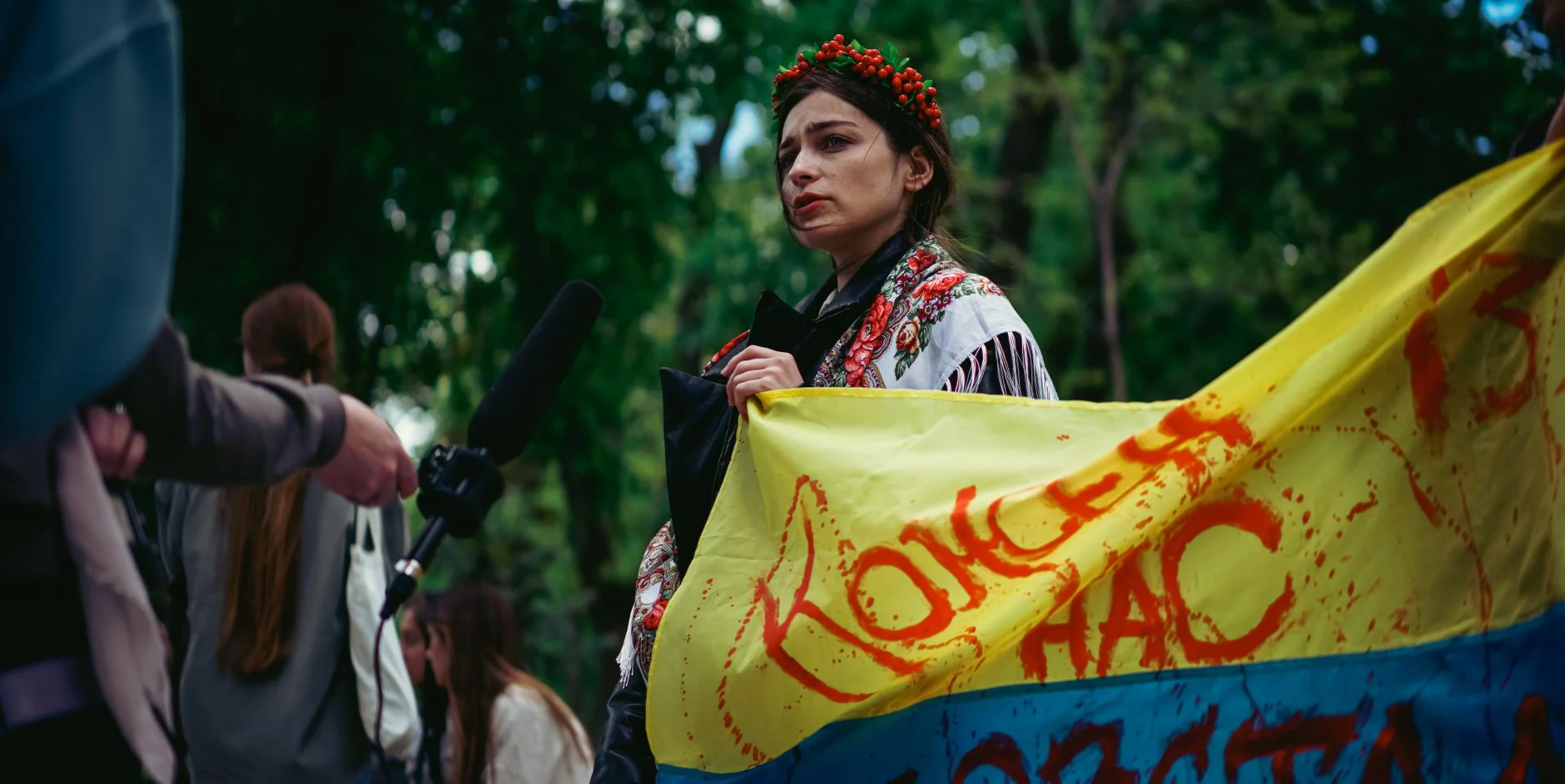 A determined woman holds a peace banner during a demonstration in Kyiv, Ukraine.
