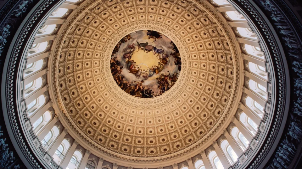 Stunning view of the United States Capitol Rotunda's ornate dome from below.