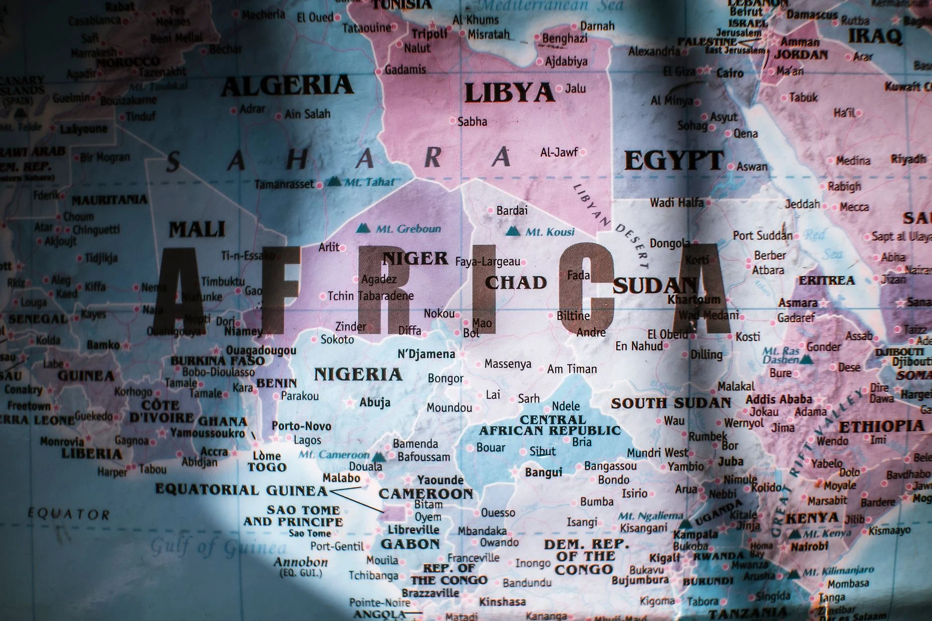 Closeup of map of Africa with countries borders and water on sunny day