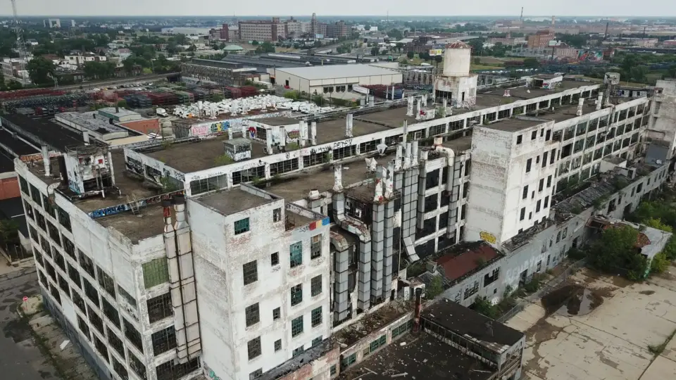 Drone shot of a large, abandoned industrial building in Detroit, Michigan.
